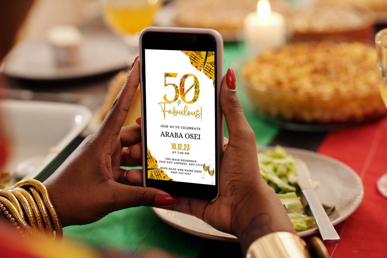 Person holding a smartphone displaying the customizable African Ankara Yellow White | 50 & Fabulous Birthday Evite template.