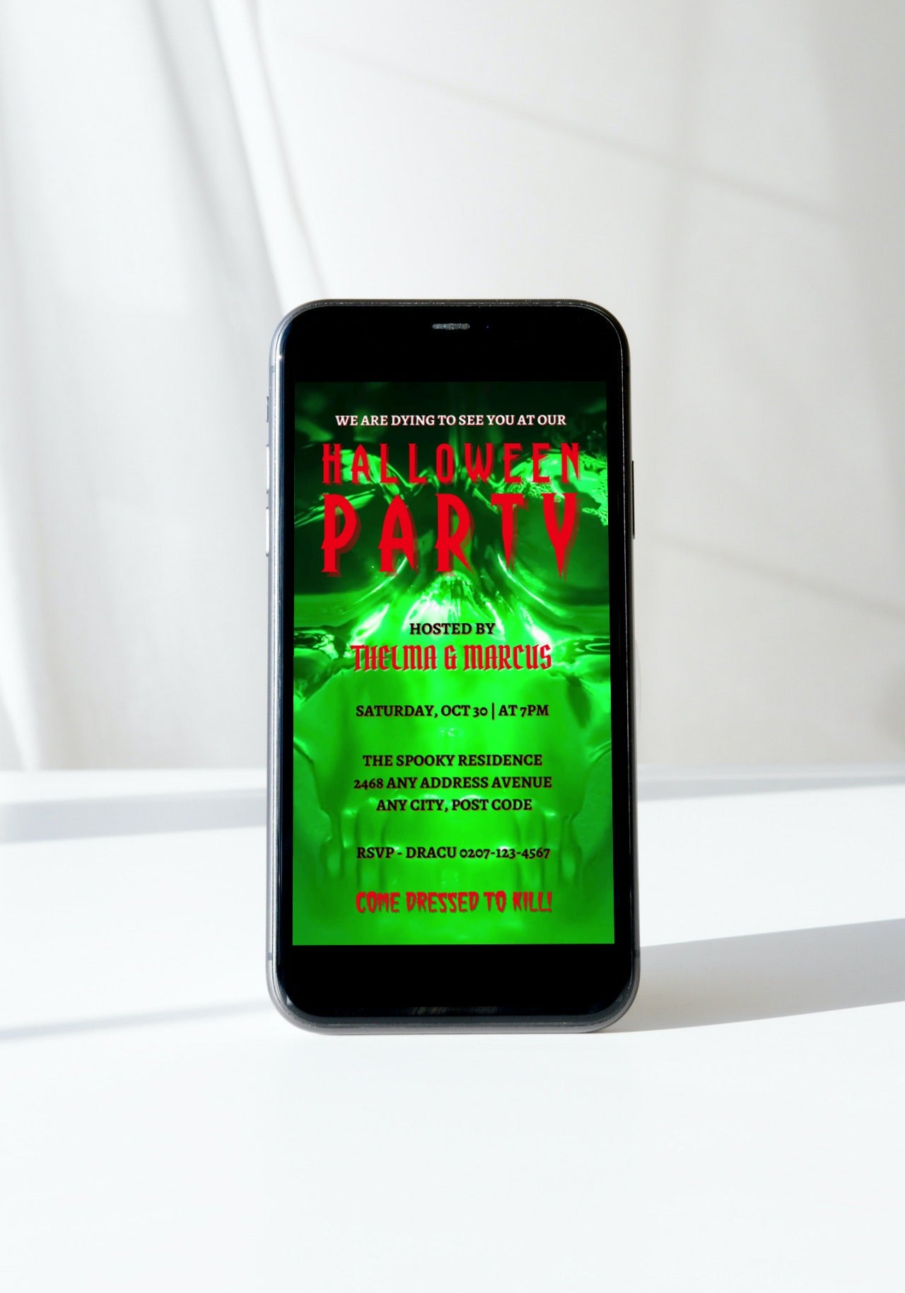 Neon Green Skull Halloween Party Video Invite displayed on a smartphone screen with editable text, showcasing a spooky invitation template for digital customization.
