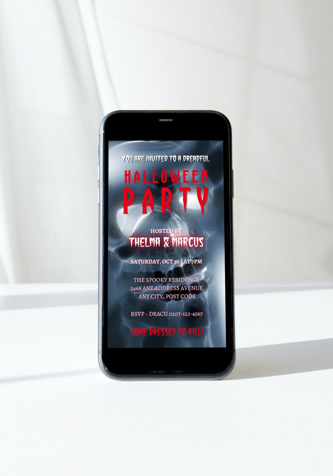 Cell phone displaying a Spooky Lava Ghost Skull Halloween Party Video Invite template with editable text and graphics.