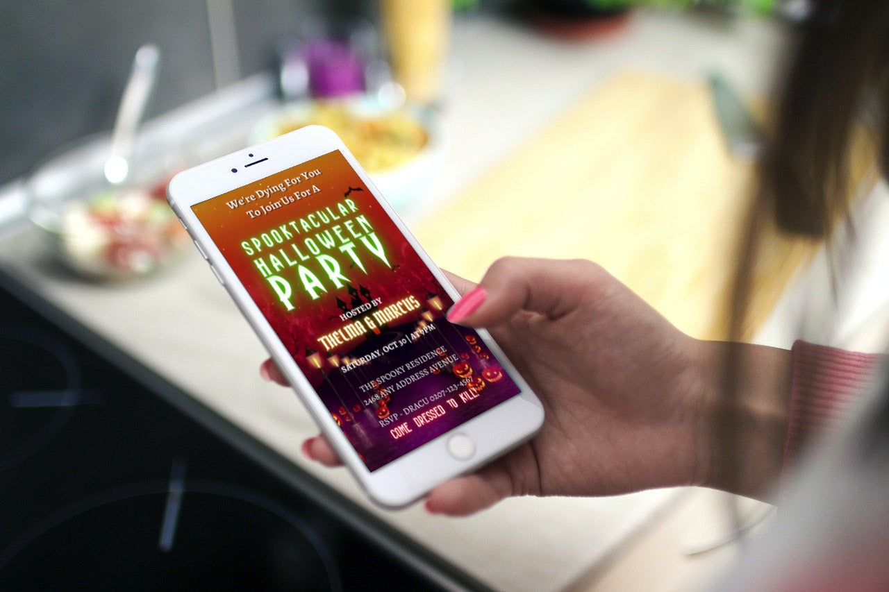Hand holding a phone displaying the Haunted House Road | Halloween Party Video Invite template, showcasing a spooky digital invitation.