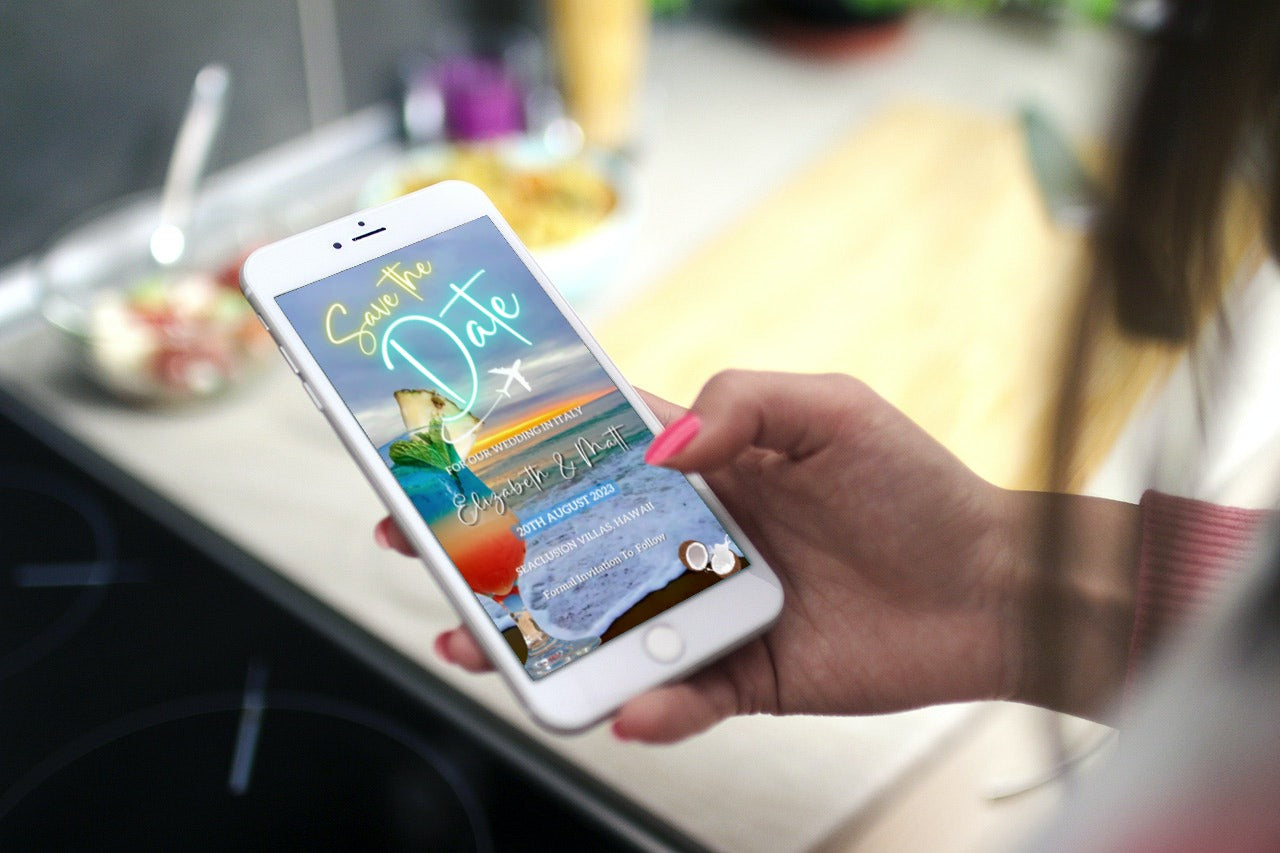 Hand holding a smartphone displaying a customizable Sunset Beach Cocktail Destination Save The Date video invitation template from URCordiallyInvited.