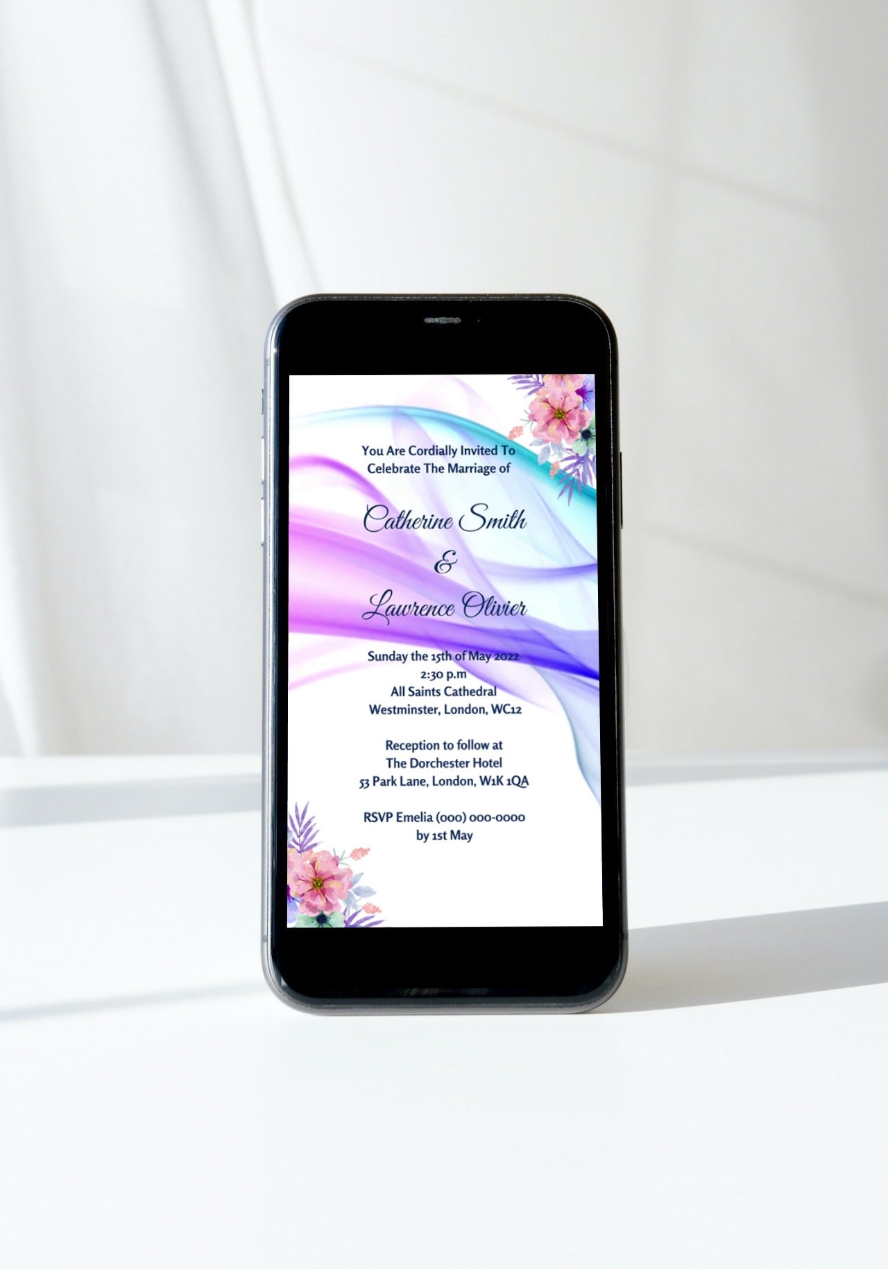 Smartphone displaying a customizable Lilac White Floral Wedding Video Invitation template, ready for personalization and electronic sharing via Canva.
