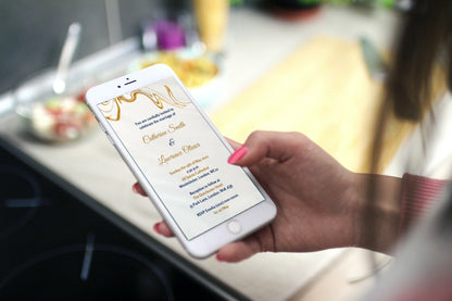 Hand holding a phone displaying the customizable Gold Silk Agate Wedding Video Invitation template, available for easy editing and sharing via Canva.