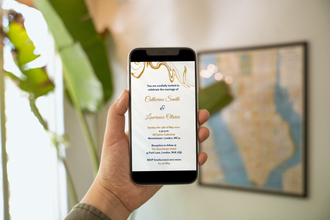 Hand holding a smartphone displaying a customizable Gold Silk Agate wedding video invitation from URCordiallyInvited.