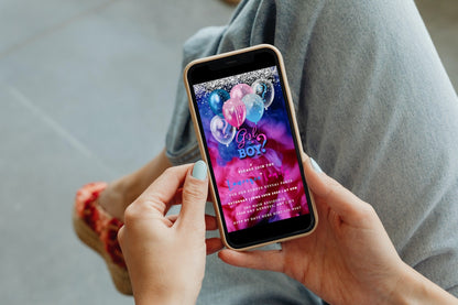 Person holding a smartphone displaying a customizable Confetti Sparkle Ink Cloud Balloons Gender Reveal Party Video Invitation template.