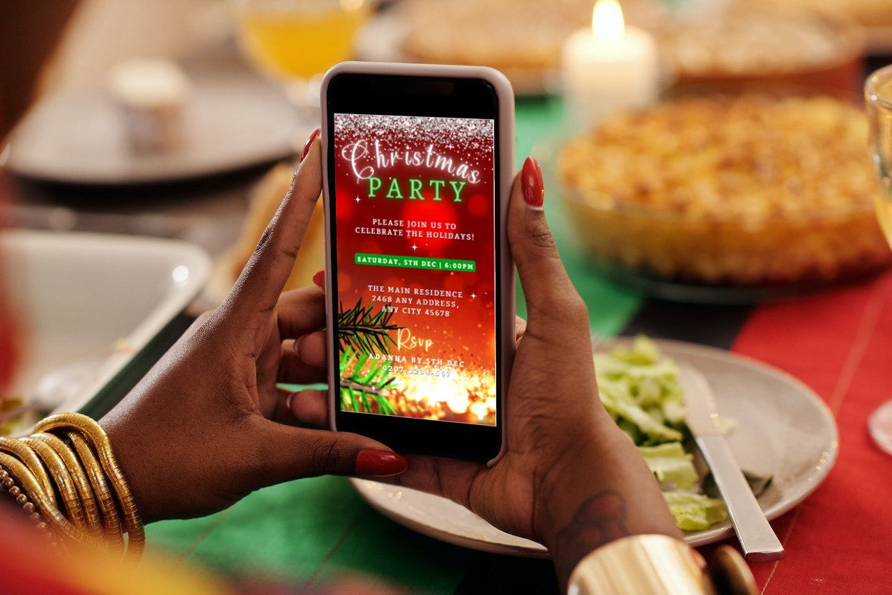 A person holding a smartphone displaying the Red Gold Glitter Christmas Video Invitation template from URCordiallyInvited.