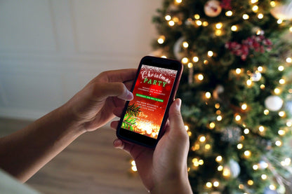 Person holding a phone displaying a customizable Red Gold Glitter Christmas video invitation from URCordiallyInvited.