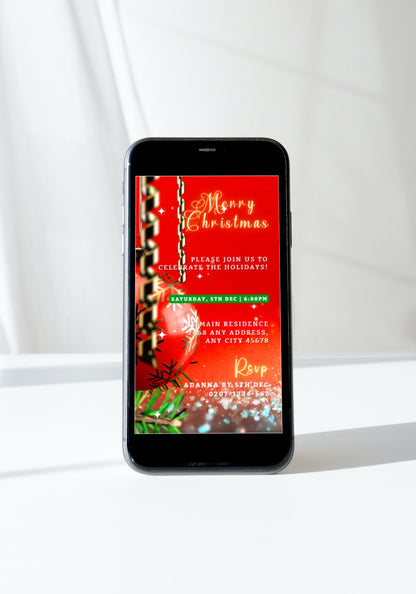 Smartphone displaying a customizable Red Gold Ornament Glitter Christmas Video Invitation template from URCordiallyInvited.
