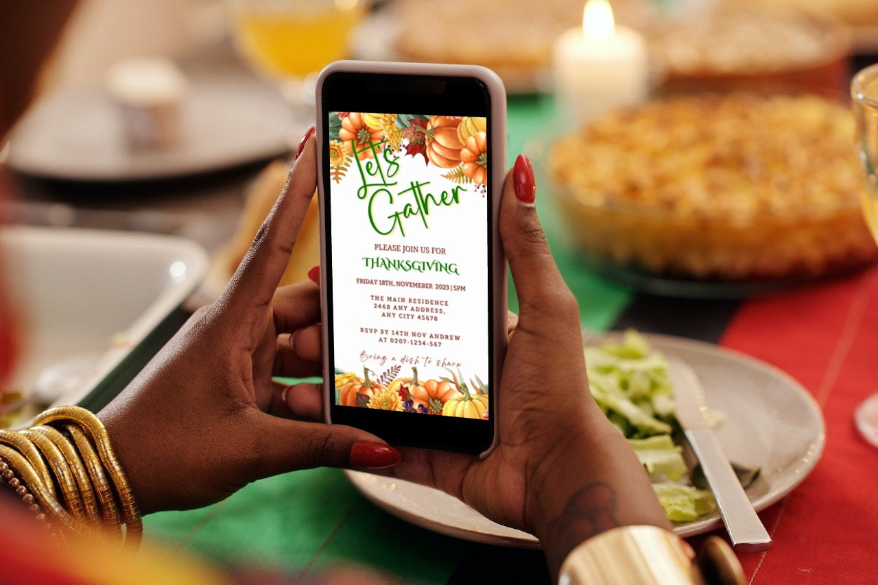 Person holding a phone displaying the Colourful Pumpkins Let's Gather | Thanksgiving Evite customizable digital invitation template from URCordiallyInvited.