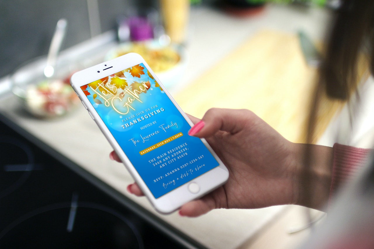 Hand holding a phone displaying a customizable Blue Golden Leaves Bokeh Thanksgiving Evite template from URCordiallyInvited, editable via Canva.