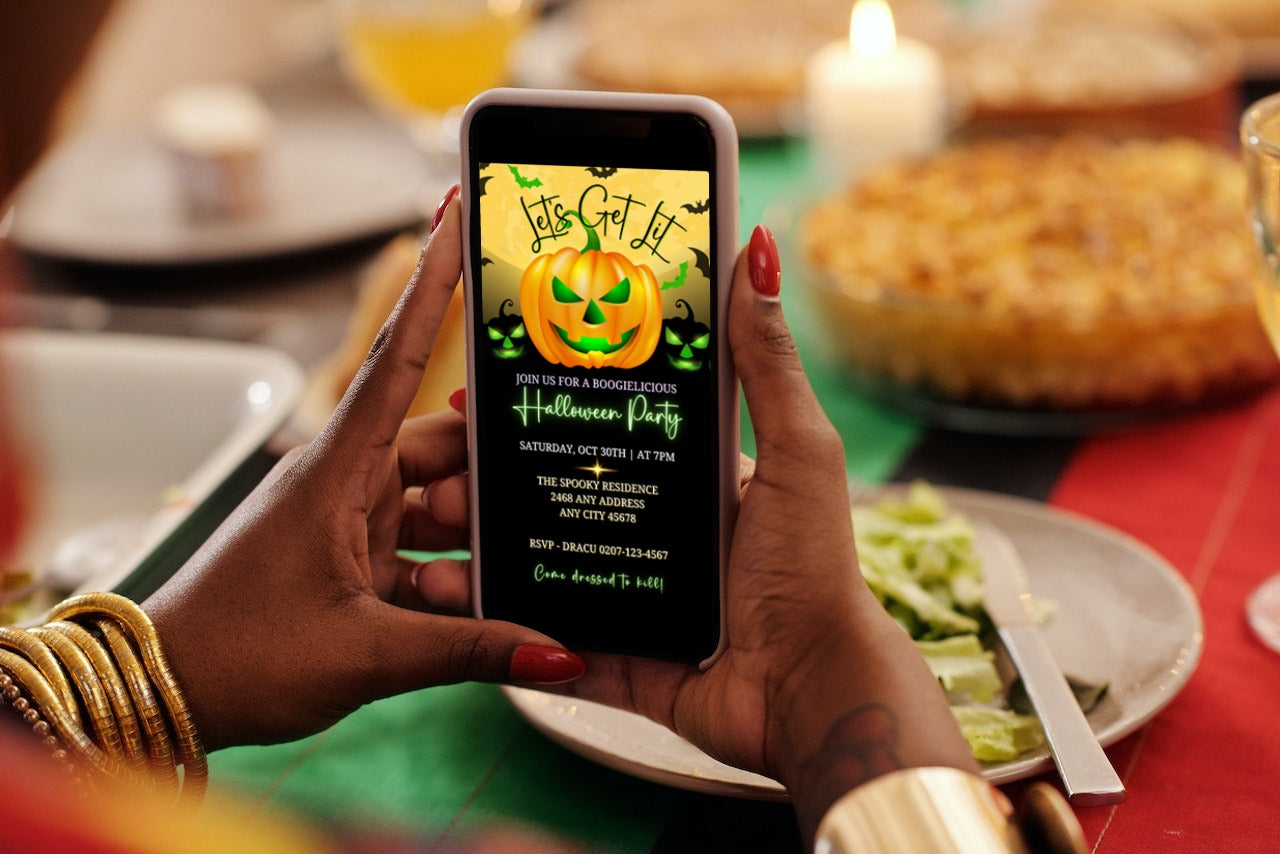 Person holding a phone with a Yellow Smiley Neon Green Pumpkin Halloween Evite displayed, showcasing customizable digital invitation template features.