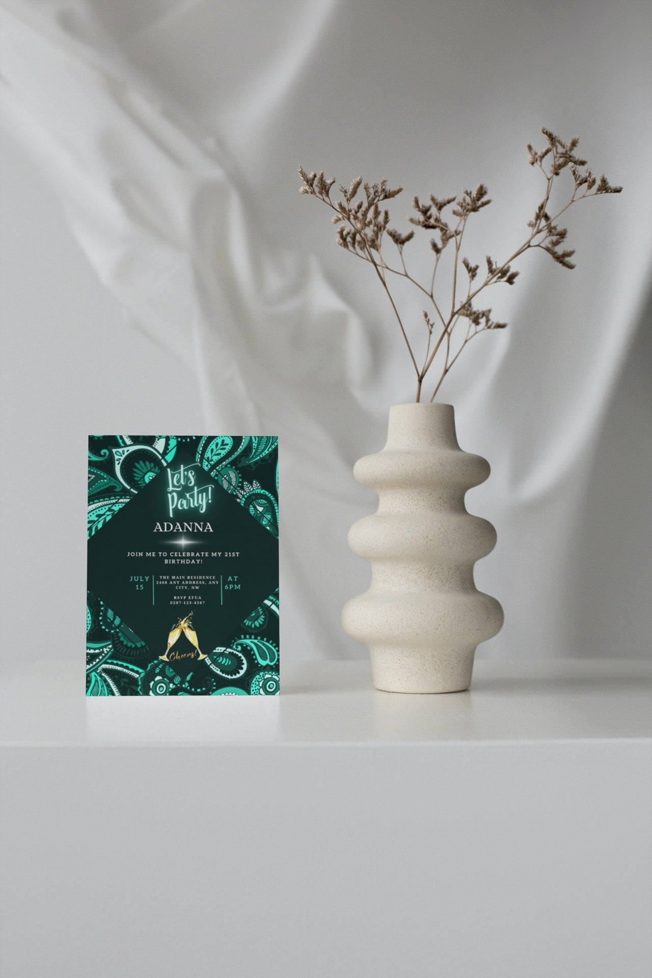 White vase with dried flowers beside a customizable Green White African Ankara digital invitation card from URCordiallyInvited.
