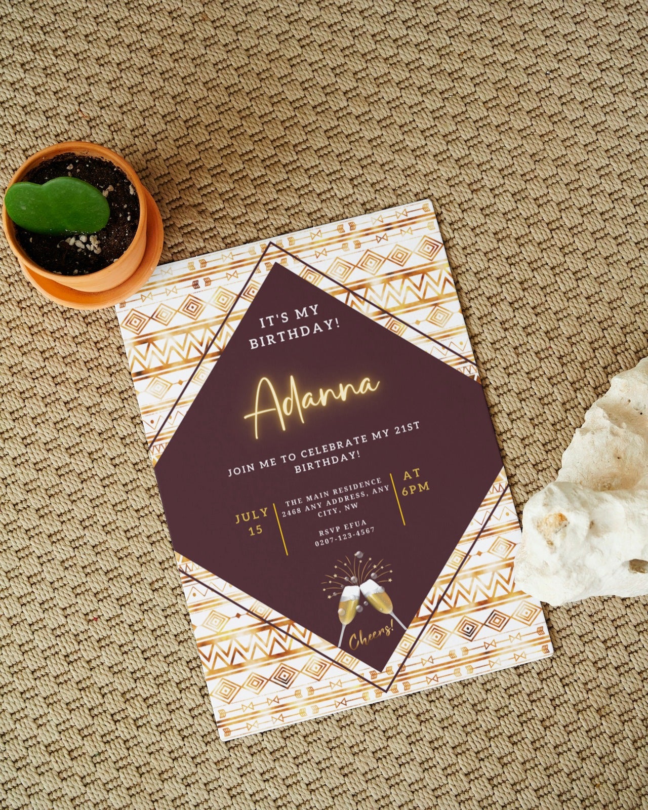 Editable Beige White African Ankara Party Evite and a small potted cactus on a carpet, showcasing a personalized digital invitation template.