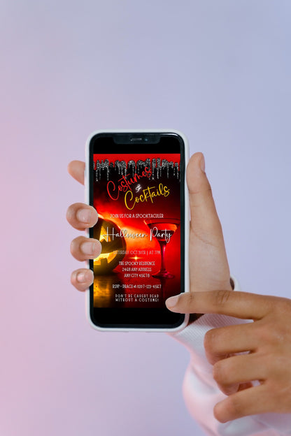 Hand holding a smartphone displaying the Red Hot Pumpkin Costumes & Cocktails | Halloween Evite customizable digital invitation template.