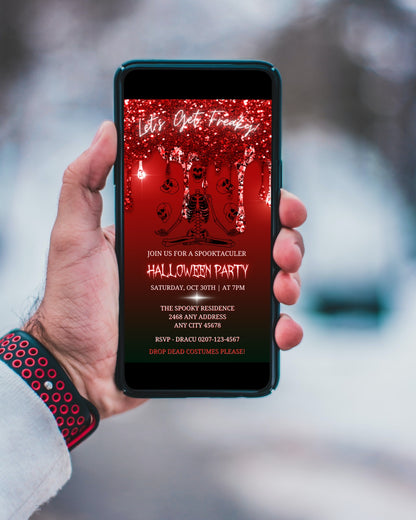 Hand holding phone displaying Red Dripping Skeleton Joggling Skulls Halloween evite template with red and black screen.