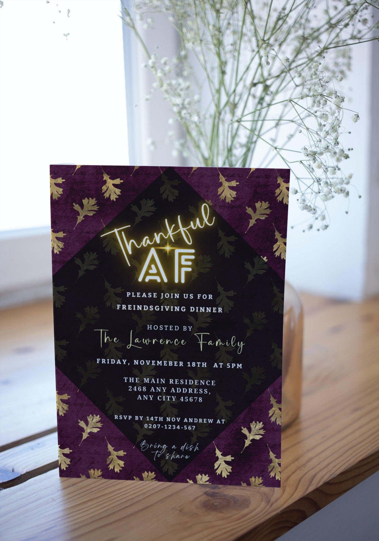A customizable Maroon Gold Falling Leaves Thanksgiving Evite with elegant white flowers and gold leaf accents, designed for digital sharing via Canva.