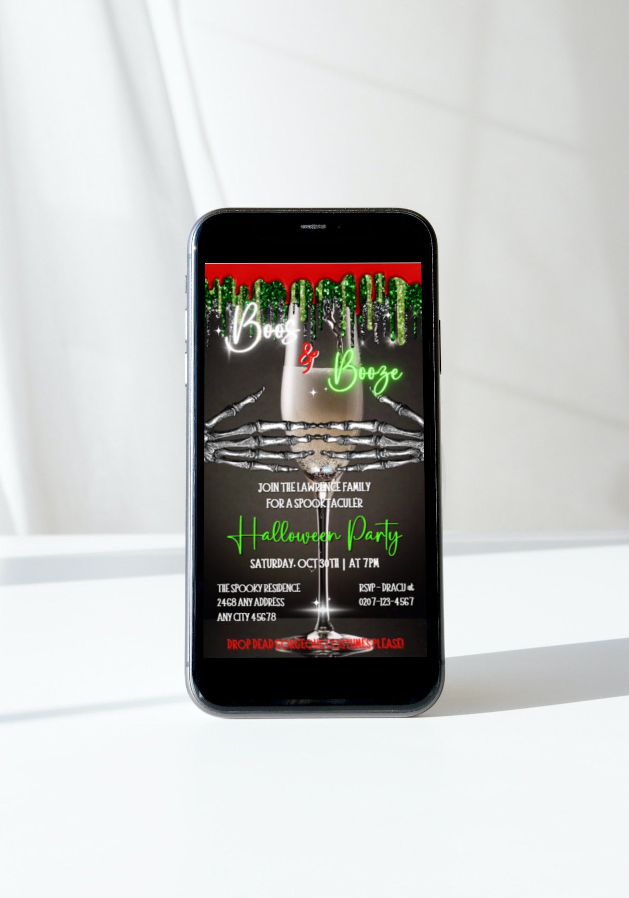 Creepy Skeleton Hands Champagne Halloween Party Video Invite displayed on a cell phone screen, featuring a spooky digital invitation with skeleton hands holding a drink.
