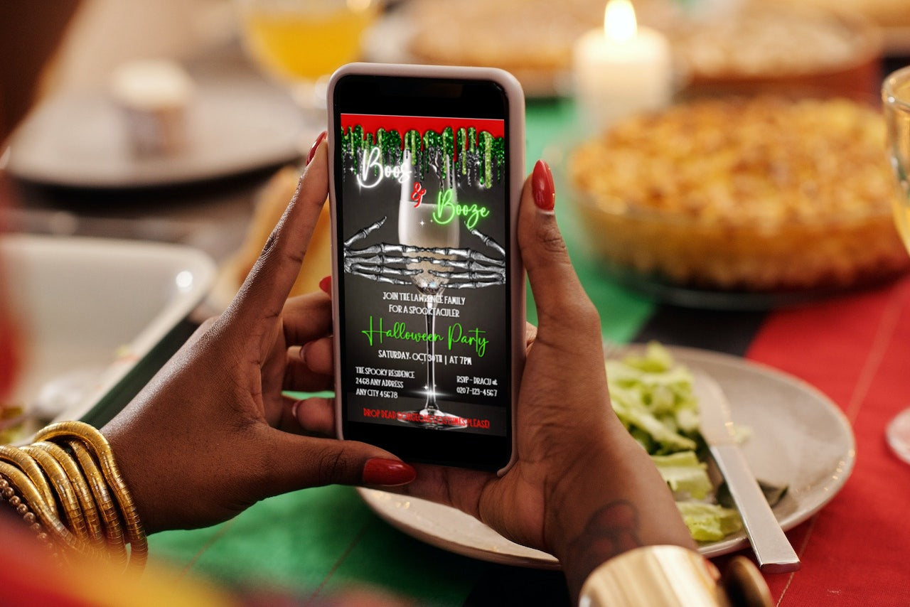 Person holding phone displaying Creepy Skeleton Hands Champagne Halloween Party Video Invite, a digital, editable template for customizable electronic invitations.