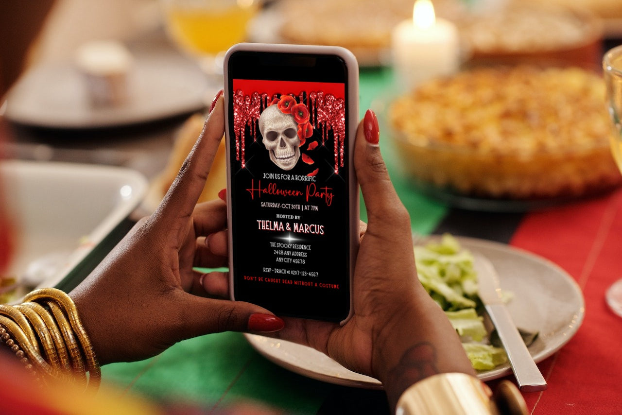 Person holding a phone displaying Dripping Red Black Fancy Rosey Skull Halloween Evite, customizable via Canva for easy electronic sharing.