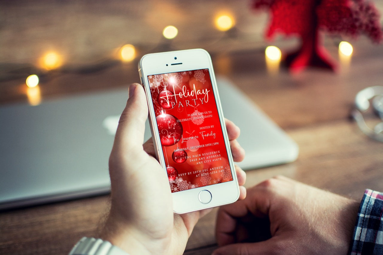 Person holding a smartphone displaying the Glowing Red White Ornaments | Holiday Party Invitation template, customizable via Canva for easy digital sharing.