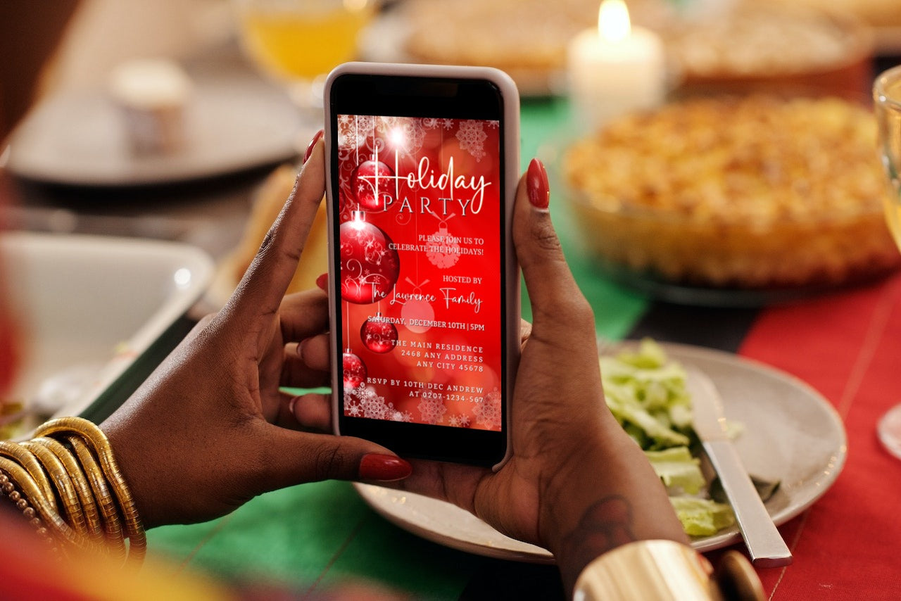 Person holding a smartphone displaying a Glowing Red White Ornaments | Holiday Party Invitation template, ready for customization and digital sharing.