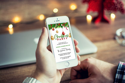 Person holding a phone displaying a customizable digital Christmas party invitation from URCordiallyInvited.