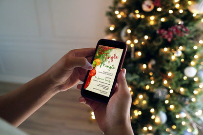 Person holding a smartphone with a Christmas tree in the background, showcasing the Colourful Jingle & Mingle Christmas Party Evite for digital customization.