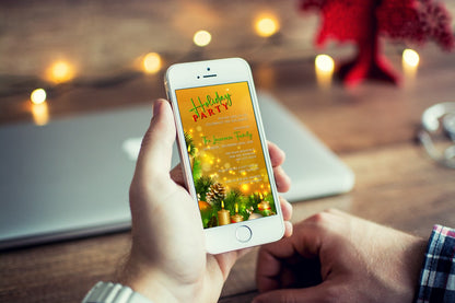 A person holding a smartphone displaying a Gold Candles Ornaments Christmas Party Evite template for easy customization and electronic sharing.