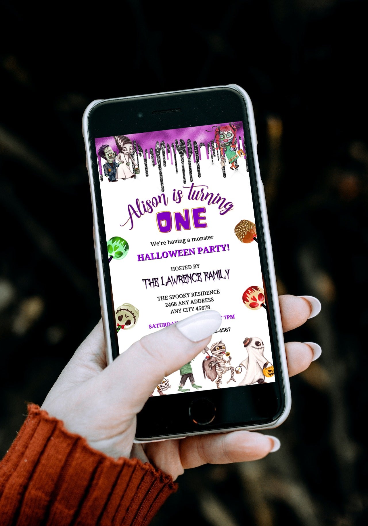 Hand holding a smartphone displaying a Gang of Monsters Halloween party evite, customizable via Canva for personal use.