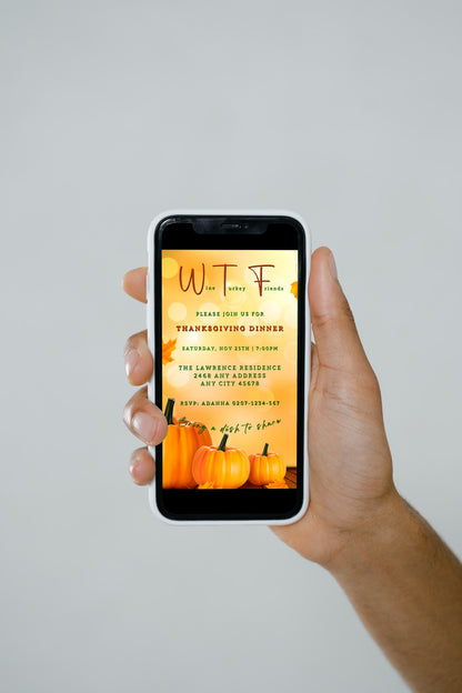 Hand holding a smartphone displaying the Golden Bokeh Pumpkin| WTF Thanksgiving Evite template, customizable via the Canva app for digital invitations.