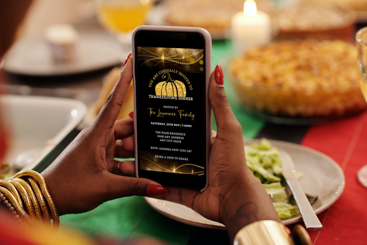 Person holding a phone displaying the Golden Pumpkin Sparkle Thanksgiving Dinner Evite, customizable via Canva for easy electronic sharing.
