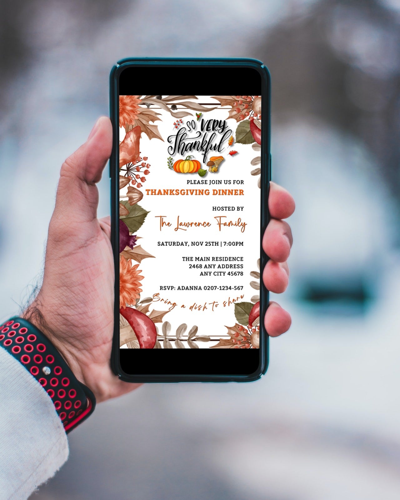 Hand holding a smartphone displaying an editable Autumn Leaves Themed Thanksgiving Dinner Evite from URCordiallyInvited.