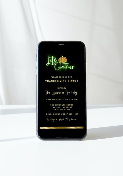 Green Neon Black Gold Pumpkin Thanksgiving Dinner Evite displayed on a lit-up cell phone screen, showcasing customizable invitation details.