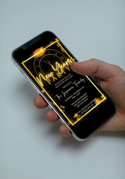 Hand holding a smartphone displaying the Editable Digital Roman Clock Golden Frame New Years Party Evite template from URCordiallyInvited.