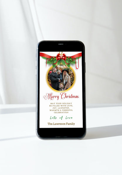 Cell phone displaying a customizable White Oval Bold Red W/Photo Frame | Merry Christmas Ecard with a family photo and Christmas tree.