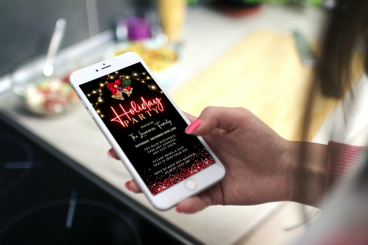 Hand holding a phone displaying a customizable Gold Bell Red Neon Holiday Party Evite from URCordiallyInvited.