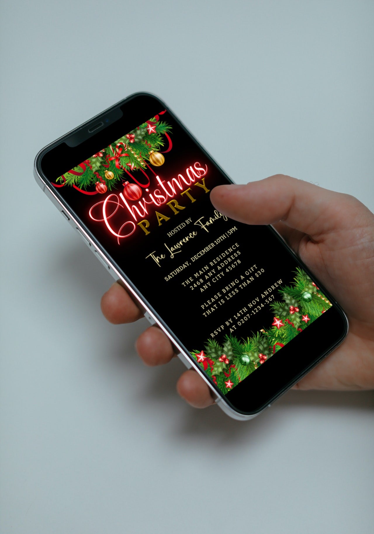 Hand holding a smartphone displaying the Green Red Neon Ornaments Christmas Party Evite template for easy DIY customization via Canva.