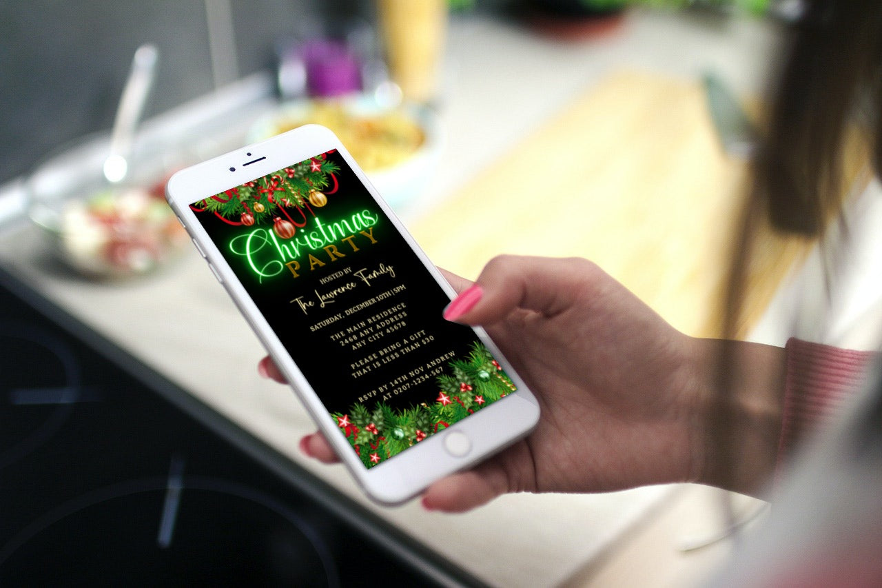 Hand holding a smartphone displaying a customizable Green Neon Ornaments Border Christmas Party Evite, available for download and editing via Canva.