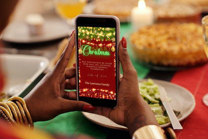 Person holding a smartphone displaying a Merry Christmas Ecard template with green neon lights, editable via Canva for digital invitations.