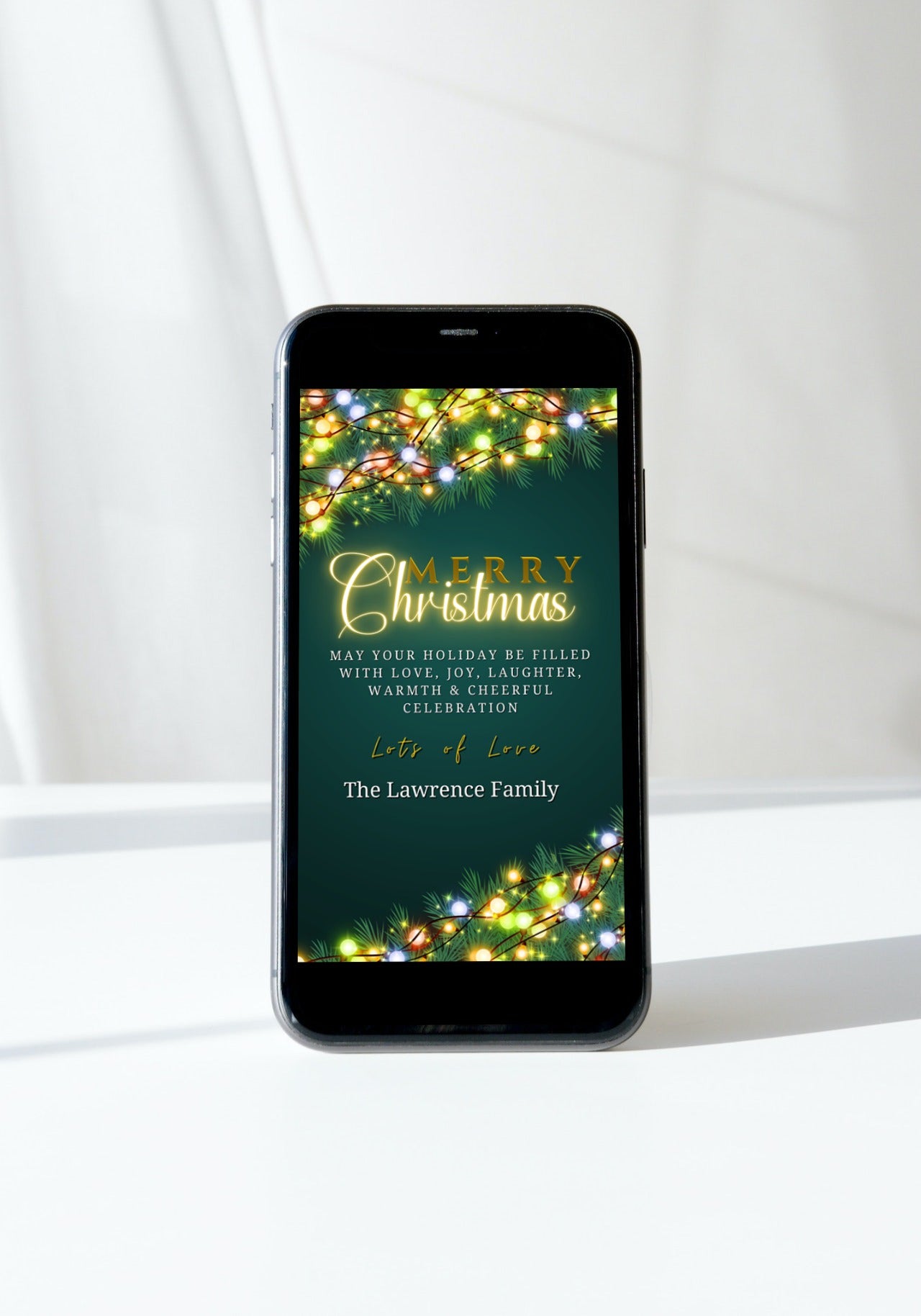 Smartphone displaying a customizable digital Christmas eCard with neon lights and text, designed for easy editing and sharing via Canva.