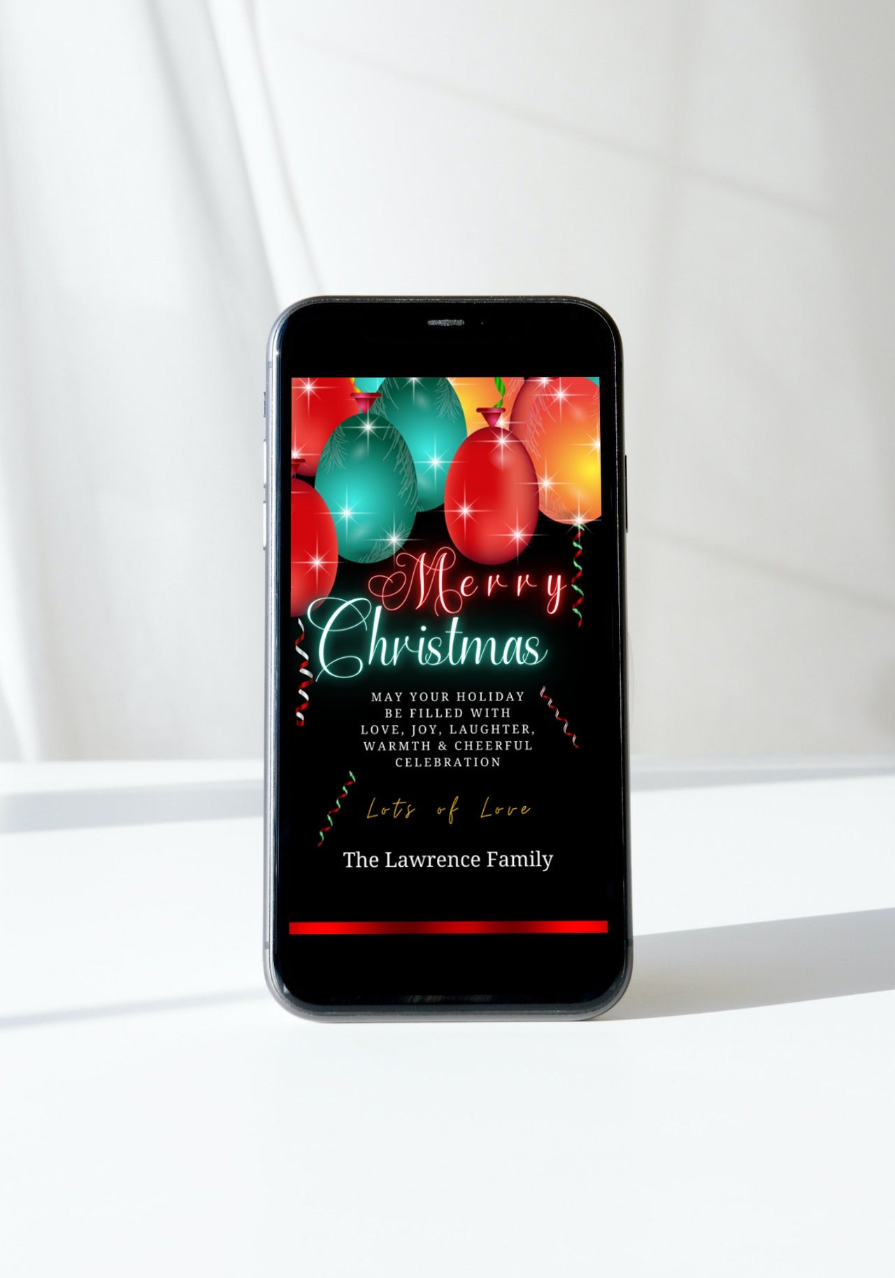 Editable digital Merry Christmas eCard featuring neon red and teal balloons with a sparkle effect on a smartphone screen.