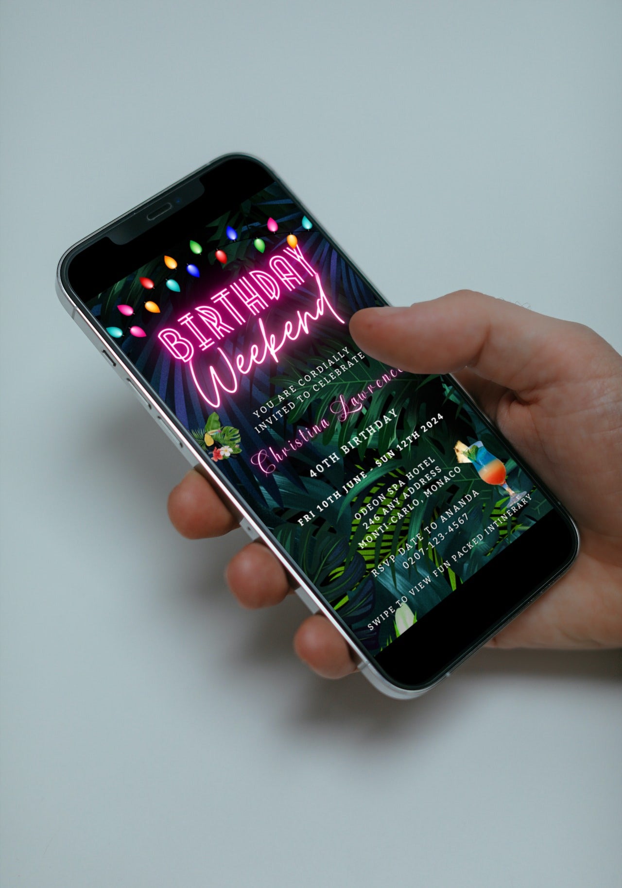 Hand holding a smartphone displaying a customizable Tropical Destination Neon Pink Weekend Party Evite template.