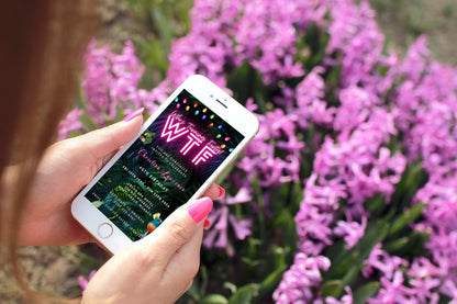 A hand holding a phone displaying a Tropical Destination Neon Pink | Who's Turning Forty Weekend Evite template for customization.