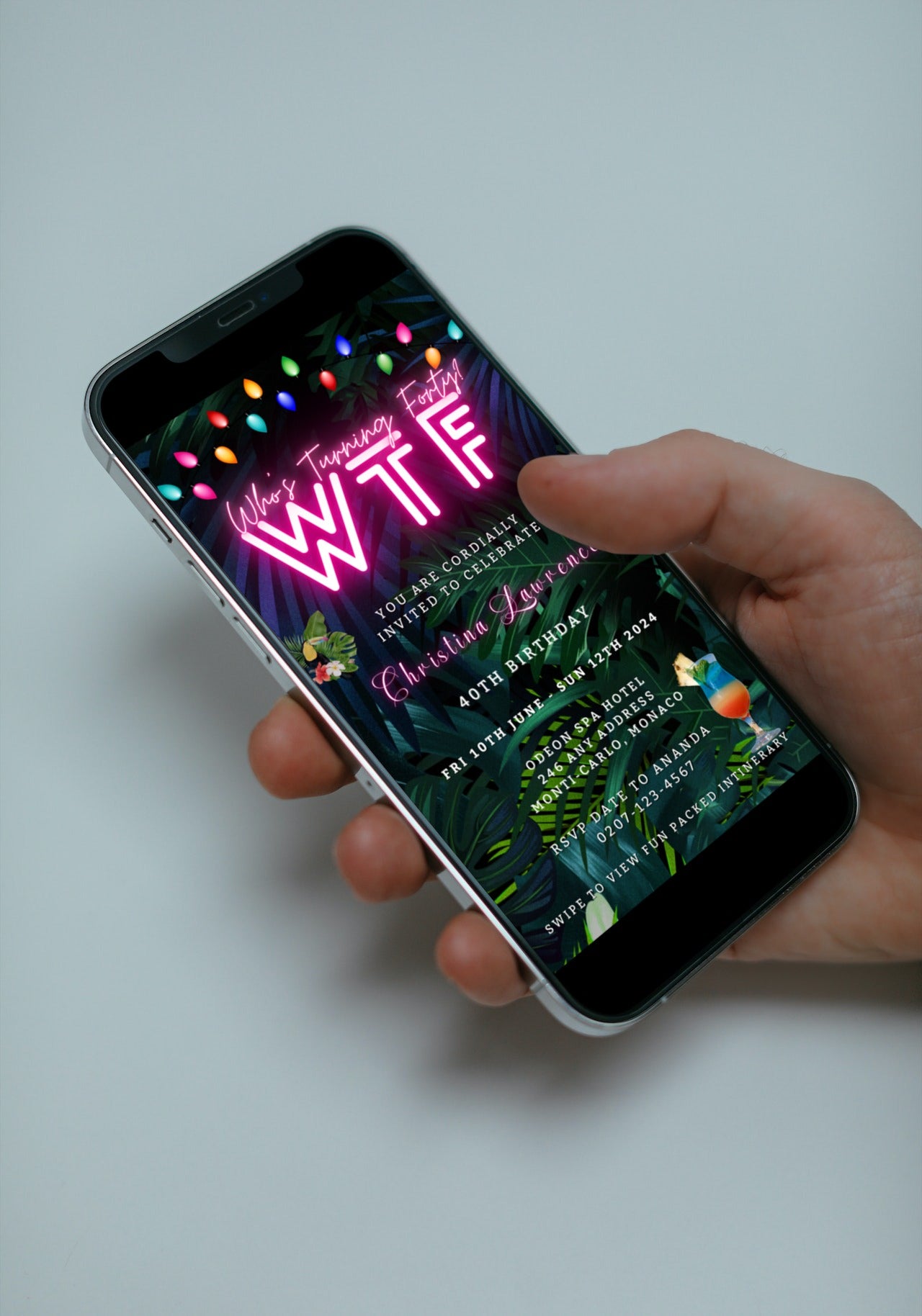 Hand holding a smartphone with a customizable Tropical Destination Neon Pink Who's Turning Forty weekend evite template displayed on the screen.