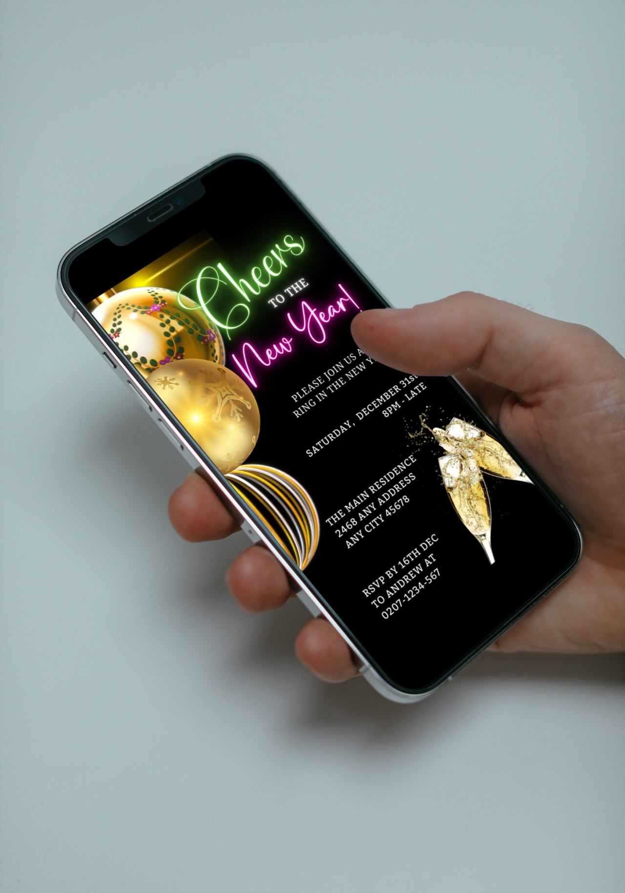 Hand holding a smartphone displaying the Neon Pink Green Ornaments Cheers New Year's Eve Party Evite, customizable via Canva for easy event personalization.