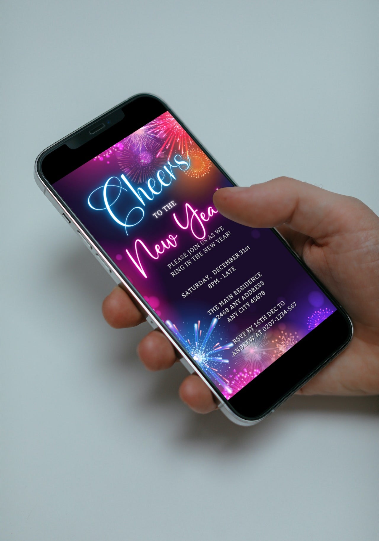 Hand holding a smartphone displaying a customizable New Year's 2024 party evite with neon fireworks, editable via Canva for easy digital sharing.