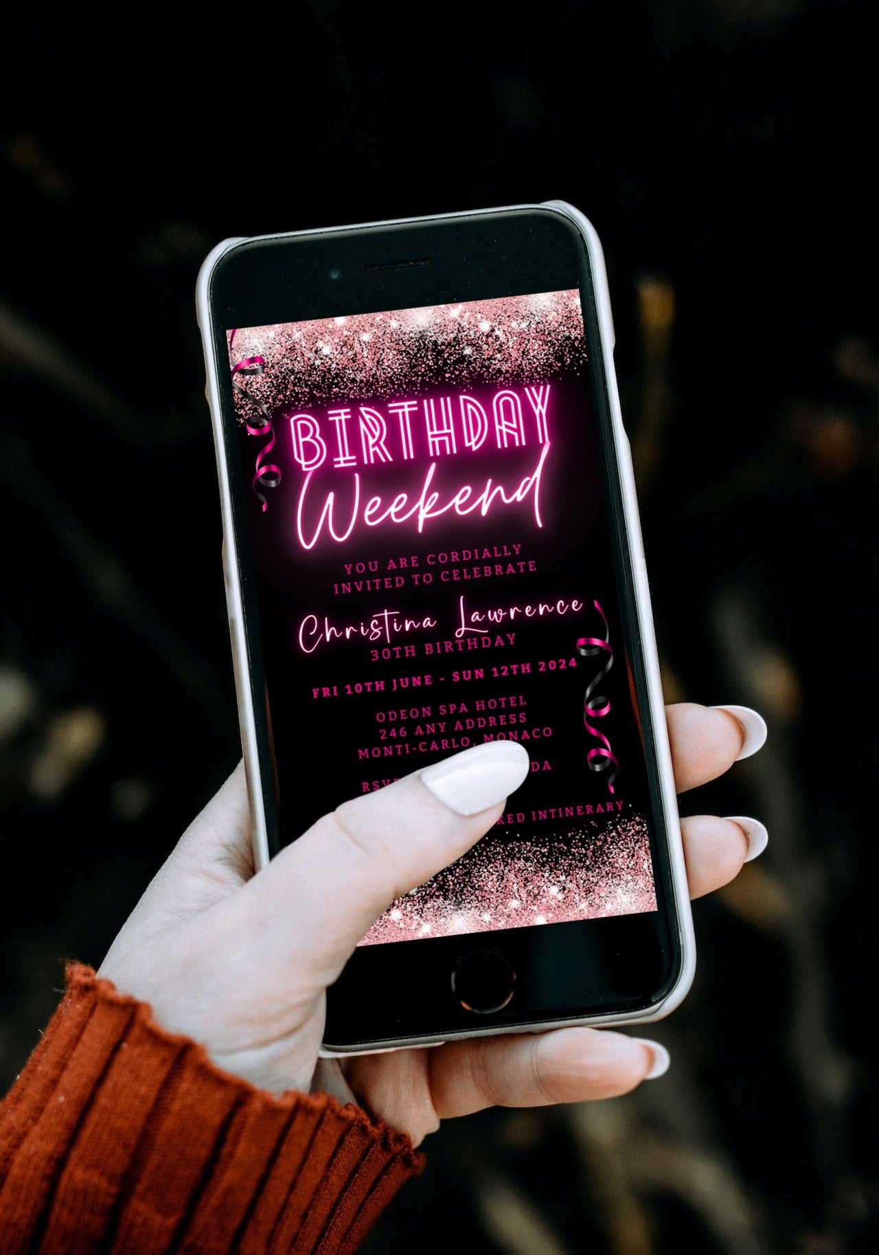 Hand holding a smartphone displaying a customisable Digital Neon Pink Glitter Confetti Weekend Party Evite template from URCordiallyInvited.