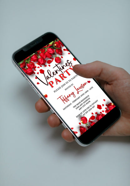 Hand holding a smartphone displaying a customizable Red Roses Border Themed Valentine’s Party Evite. This digital invitation is editable via Canva for easy sharing.