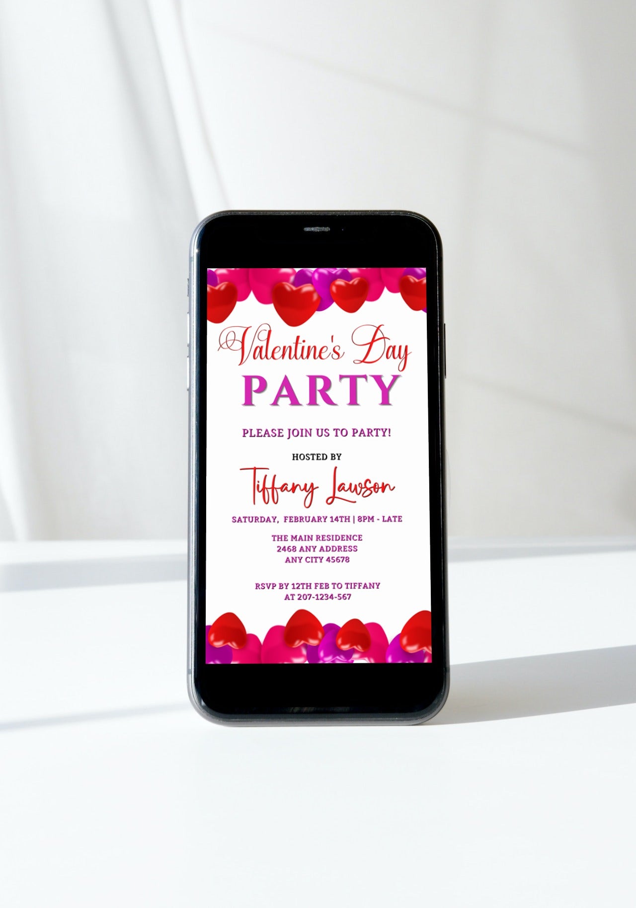 Pink Red Hearts | Valentines Party Evite displayed on a smartphone screen, featuring editable text and heart designs for customizing party invitations via Canva.