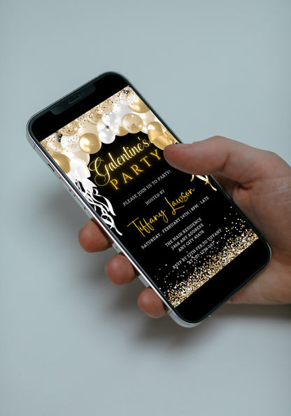 Hand holding a smartphone displaying a customizable Gold White Balloons Glitter Galentines Party Evite, ready to be edited and shared.